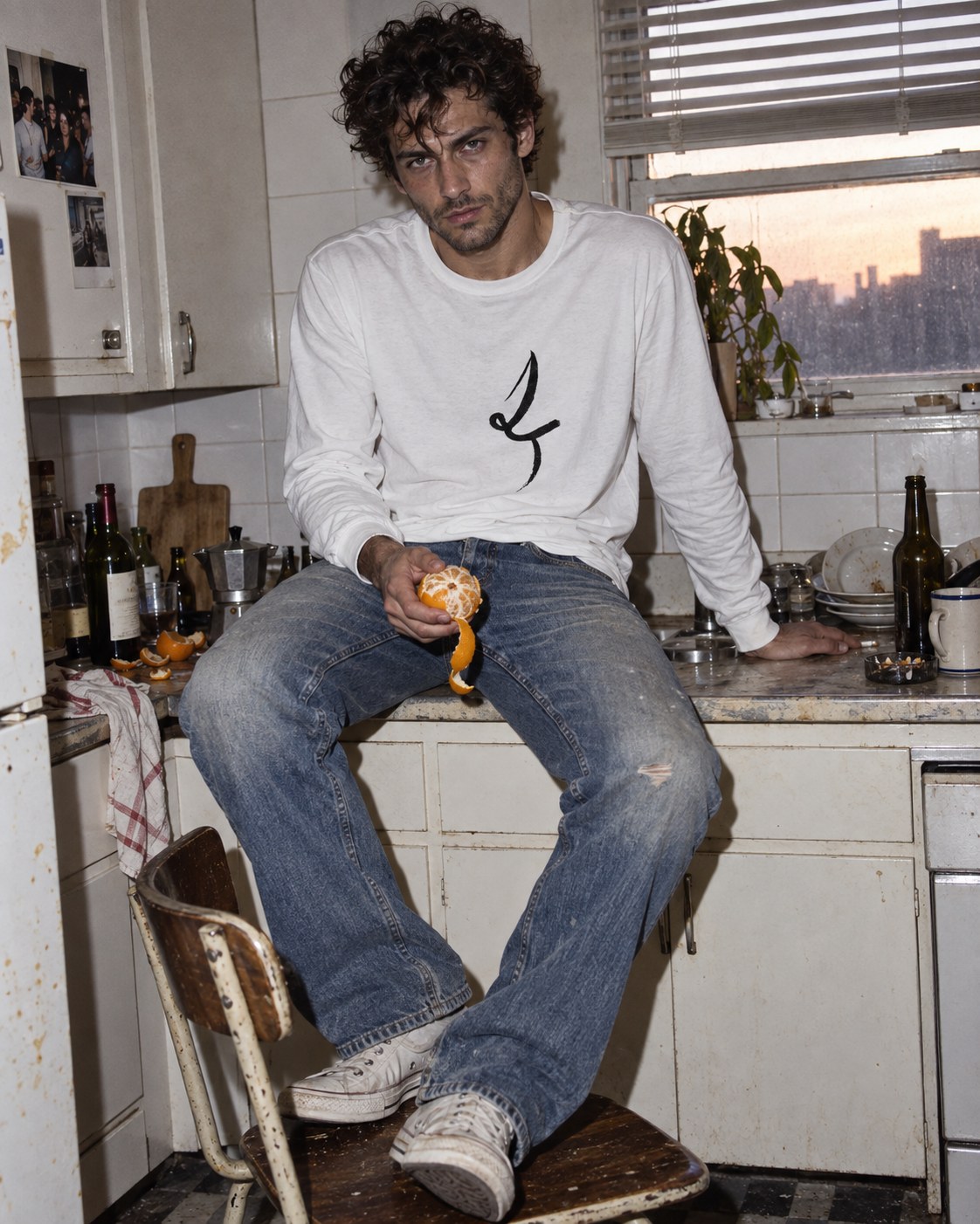 White One Line long-sleeve tee with black ink drawing, styled in a kitchen